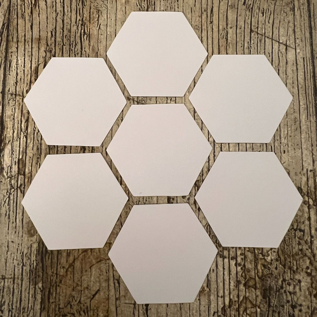Hexagonal tiles on a wooden surface