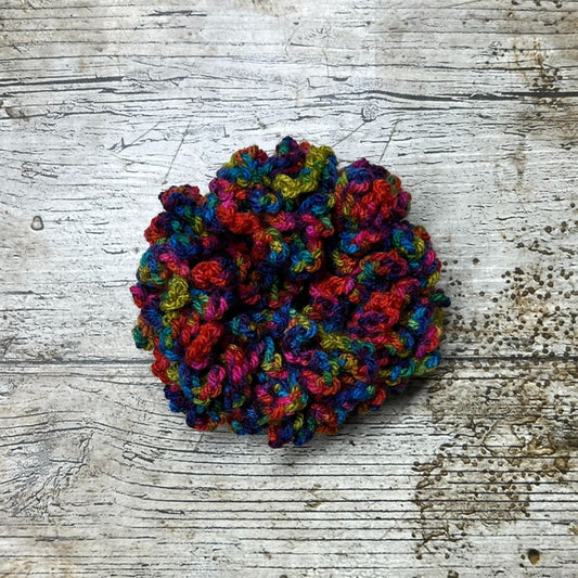 This Dancin colourway from the King Cole Jitterbug range is wonderful, with wonderful bright colours, its crocheted into a lovely bright colourful scrunchie.