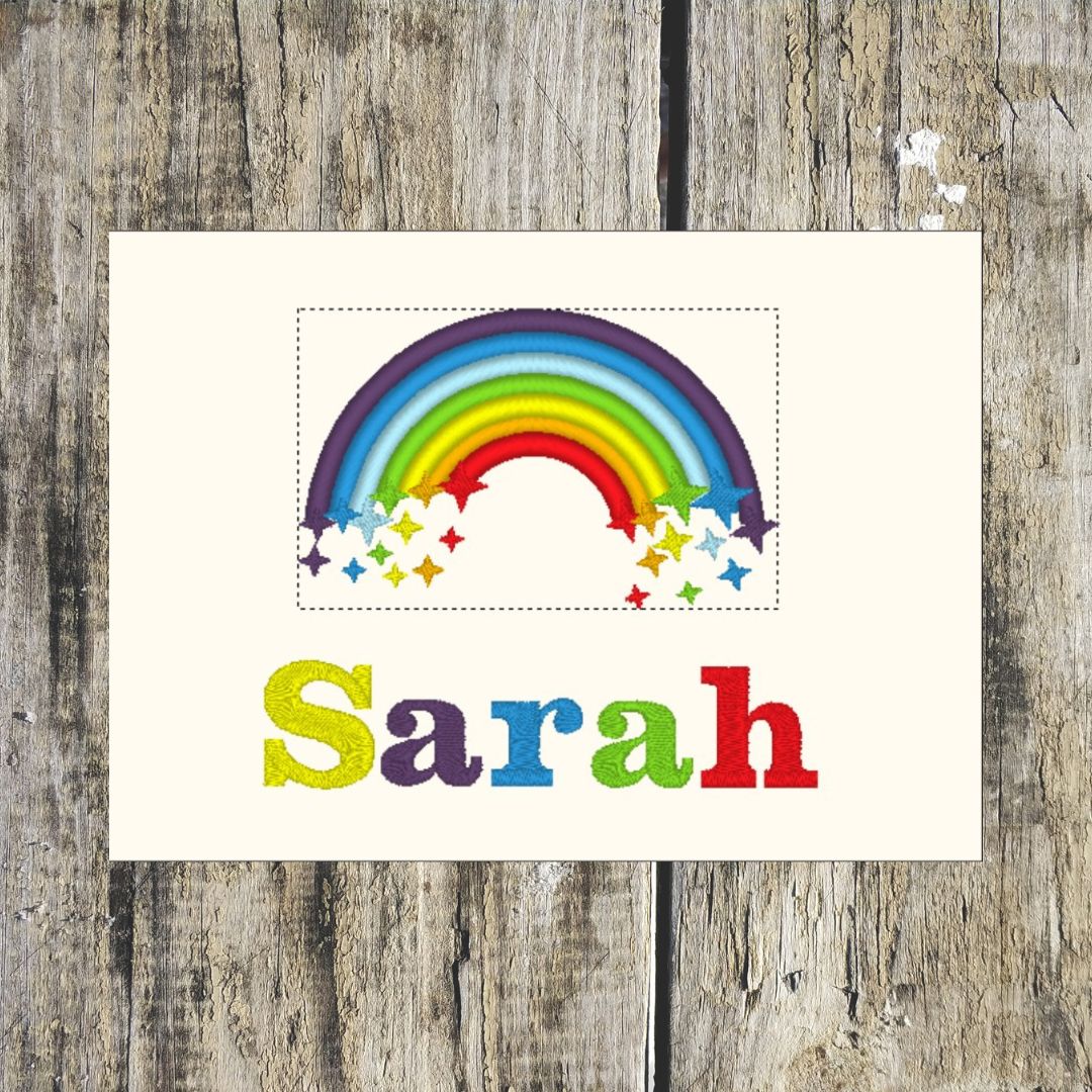 Colourful rainbow with stars and the name 'Sarah' personalised layout on a wooden background