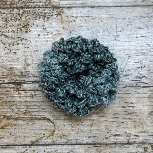 This gorgeous scrunchie is made with King Cole Jamboree yarn and the colour way is called Glamping Green. The colours are soft and subtle and just beautiful too.