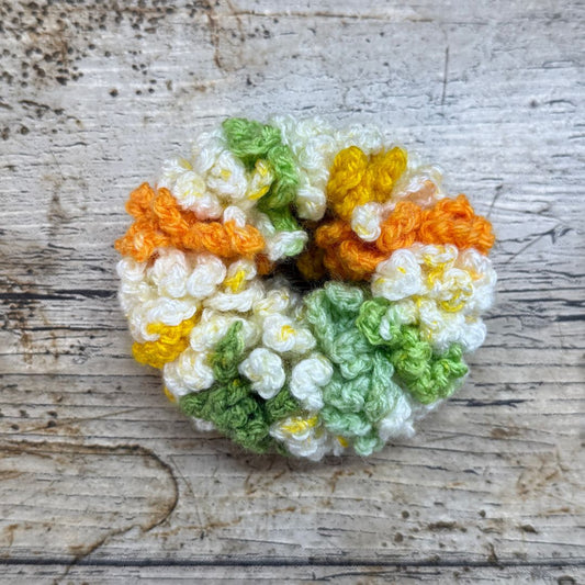 There are such beautiful colours in this scrunchie that has been made by Coralie at Coralie's Crafts & Gifts - Oranges, creams, greens and yellow. Perfect gift to brighten up your pony tail hairstyle.
