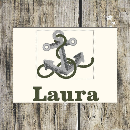 Anchor design personalised towel layout, with the name 'Laura' on a wooden background