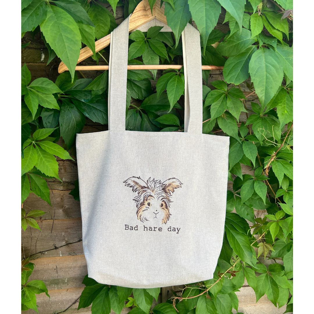 This gorgeous handmade tote bag is lovely with a beautiful hare embroidered onto it with the quote "Bad hare day". The Bag is completely handmade and is fully lined inside with a pocket attached at the top.