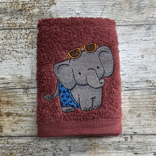 This gorgeous elephant, is ready for his day at the beach, with his shorts and sunglasses, he is ready and waiting to be embroidered onto face cloths as a special gift for someone. 