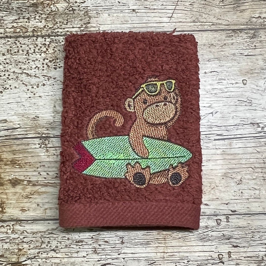 This cute monkey design is ready for a day of surfing at the beach, and is embroidered onto face cloths to order at Coralie's Crafts & Gifts in Blandford, Dorset