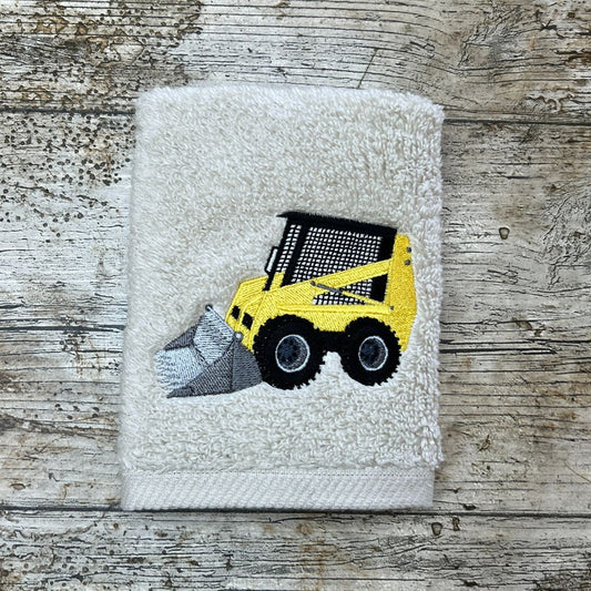 Fabulous Caged Digger Design embroidered onto a face cloth, placed on a wooden background, by Coralie's Crafts & Gifts