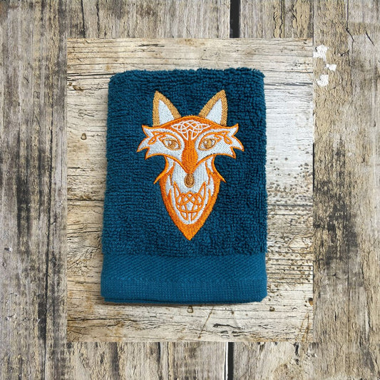 Lovely Bright orange Celtic fox design embroidered onto face cloths to order at Coralie's Crafts Gifts in Dorset.