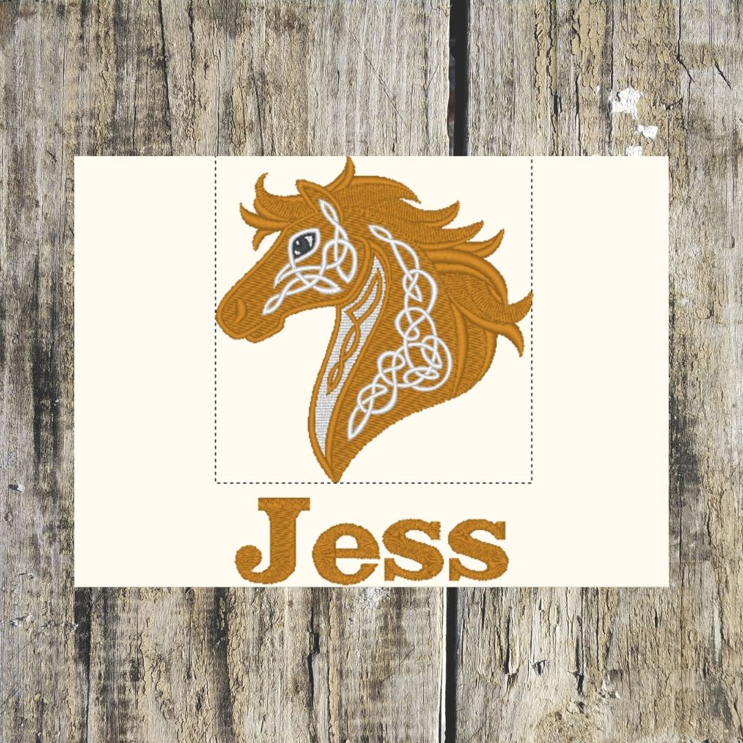 Celtic horse design on a white background, with the name Jess underneath it, on a wooden background, this layout shows how it will look laid out for personalised towels
