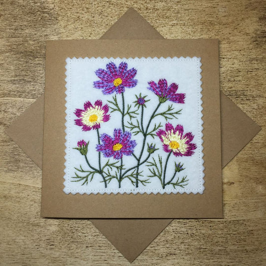 Embroidered card with flowers on a brown envelope