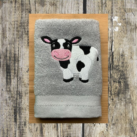 Beautiful Cow design embroidered onto a super soft face cloth that is 100% cotton.