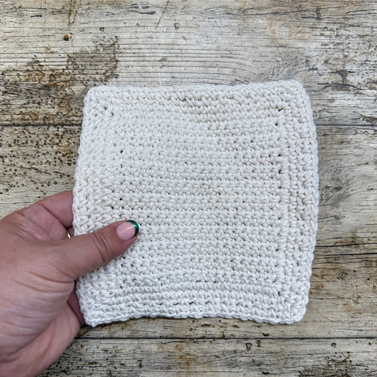 Learn how to make a crochet dishcloth, by making a centre panel and then learn how to crochet round the outside 