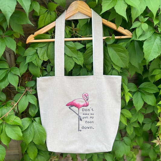 Handmade tote bag with a gorgeous pink flamingo embroidery design on it with the quote "Don't make me put my foot down". We love this quote and love making this bag at Coralie's Crafts & Gifts