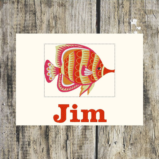 A beautiful funky fish design personalised with a name underneath, on a wooden background, this layout can be embroidered onto hand towels & bigger towels