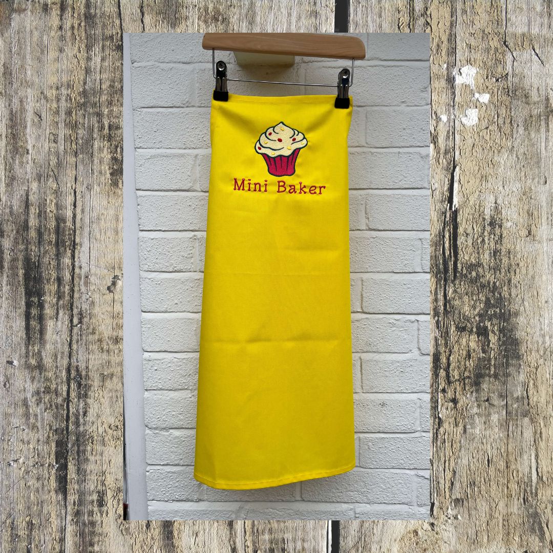 This wonderful Yellow mini baker apron has a wonderful cupcake design on it, with added sprinkles and the wording Mini Baker on it