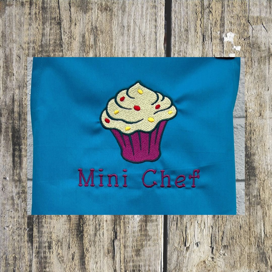 Beautiful Cupcake design is embroidered onto Children's aprons with the wording Mini Chef, Kids apron sizes are ages 3-6 or age 7-10.