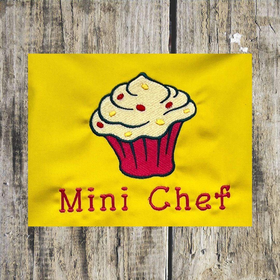 Beautiful Cupcake design is embroidered onto Children's aprons with the wording Mini Chef, Kids apron sizes are ages 3-6 or age 7-10.