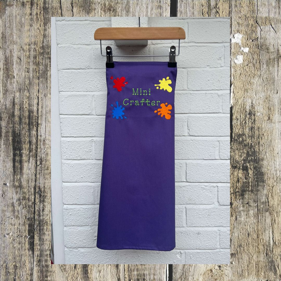 This wonderful Purple Mini Crafter Apron has embroidered splodges of paint on it and the wording  Mini Crafter, Here is the full size of the apron,  all embroidered by Coralie at Coralie's Crafts & Gifts.