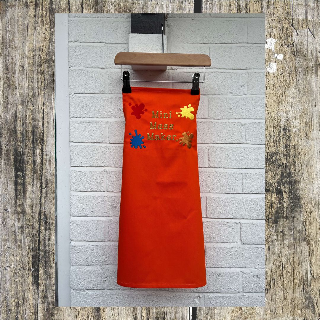Full size picture of the orange apron, each apron has fully adjustable strap with a safety clip on. 