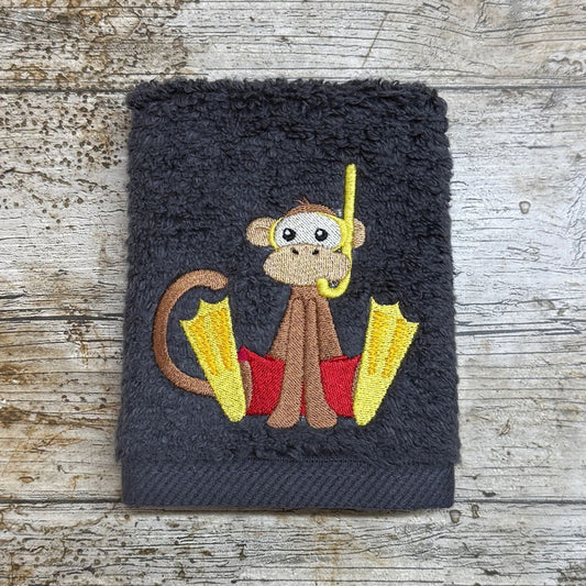 this wonderful monkey design with flippers and snorkel is fully embraced to go investigating in the sea, this lovey design is embroidered onto face cloths to order at Coralie's Crafts & Gifts in Dorset.