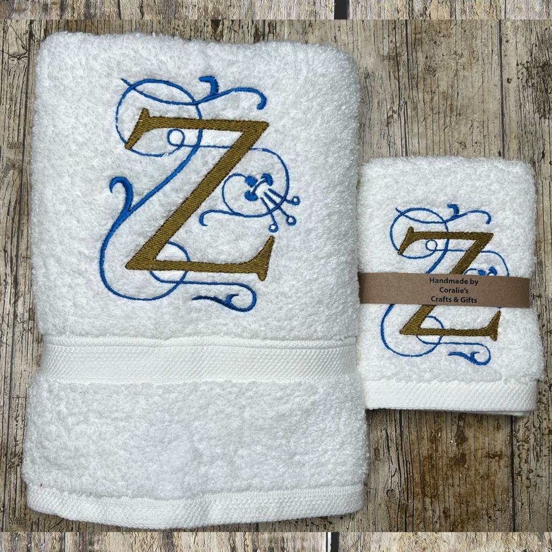 White towels with embroidered letter 'Z' on a wooden surface