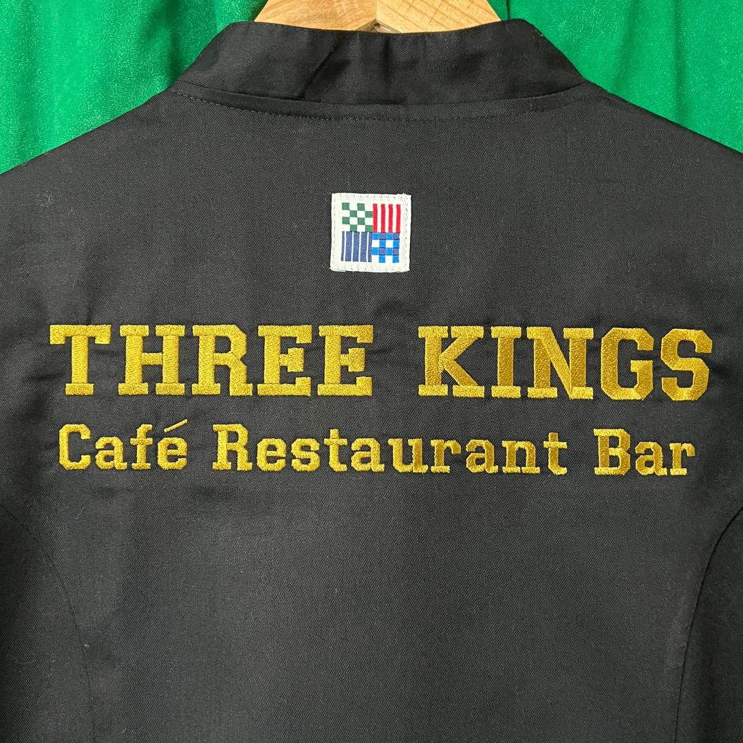 The back of Chef jackets embroidered for the Three Kings Café Restaurant Bar, that is based in Blandford Forum, Dorset.