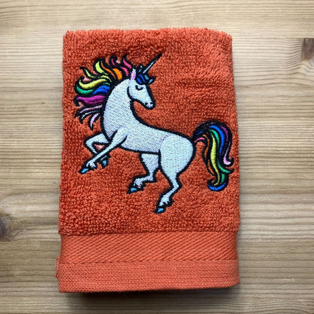 Beautiful unicorn design with fabulous rainbow mane, embroidered onto super soft face cloths to order, at Coralie's Crafts & Gifts. 