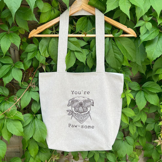 A beautiful handmade tote bag, with a gorgoeous pug embroidered on the front with the wording "Your're Paw-some", the tote bag is all fully lined inside